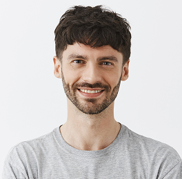 adult dark haired man smiling
